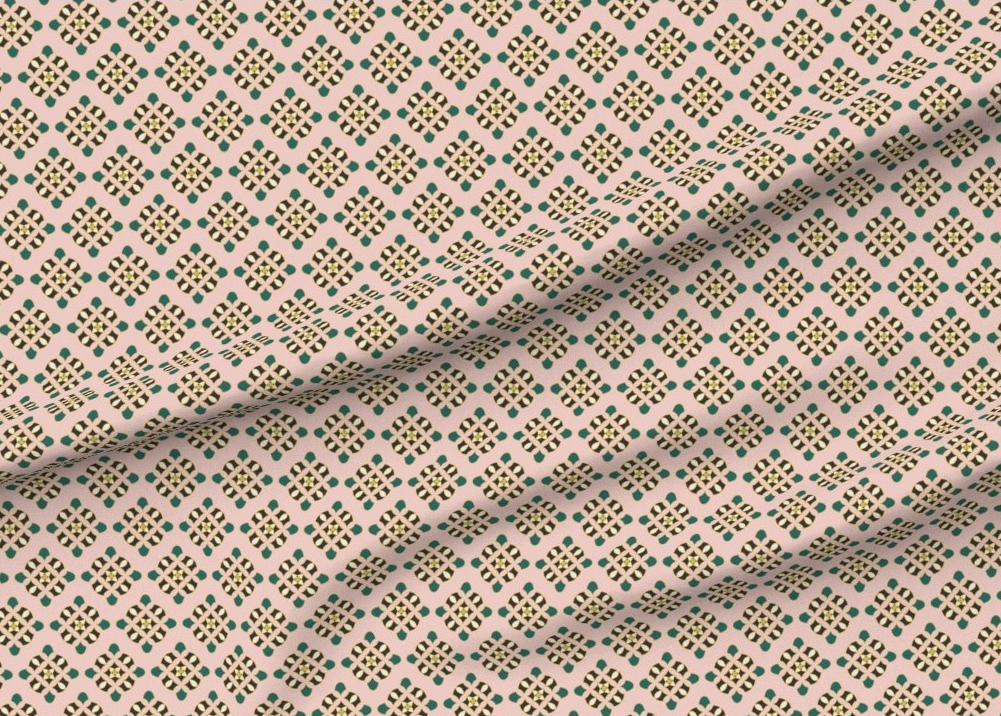 Fabric with diamond Palm Beach Regency style medallions on a pink background.