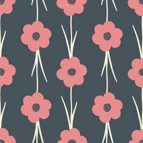 Pattern of pink flowers with green stems on a dark blue background
