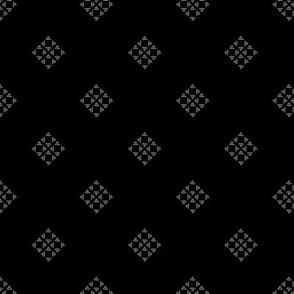 Black and white geometric pattern on a black background