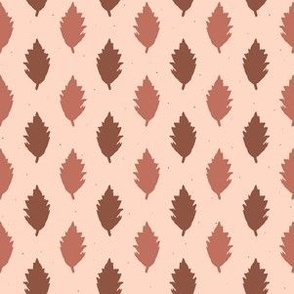 Pattern of brown leaves on a beige background