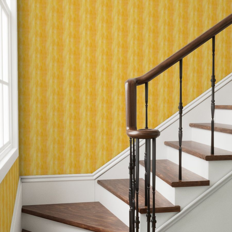 Staircase with wooden steps and handrail against a orange yellow wallpaper by Erica MacDonald.