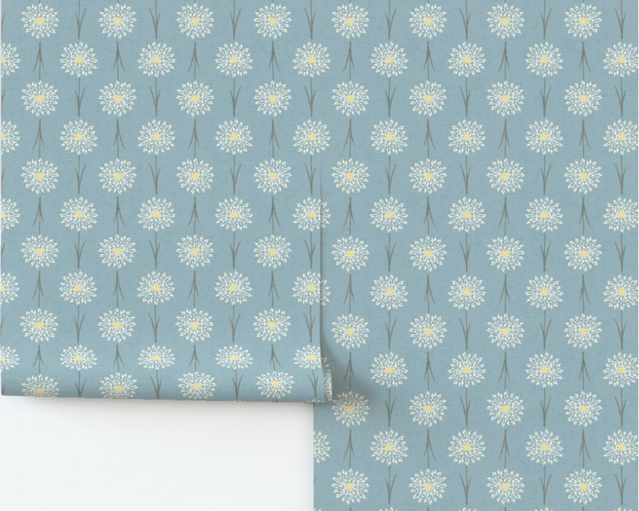 Roll of wallpaper with a floral pattern on a blue background