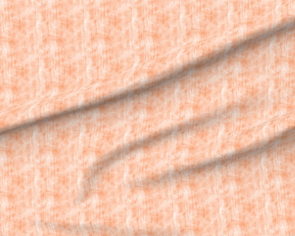 Close-up of textured peach-colored fabric with a subtle pattern