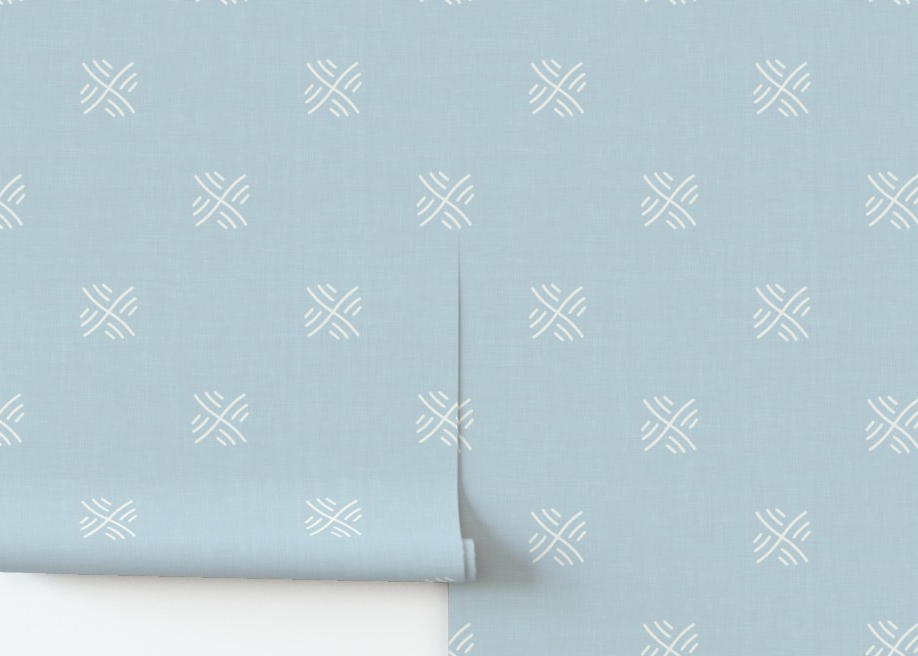 Roll of light blue wallpaper with white geometric pattern