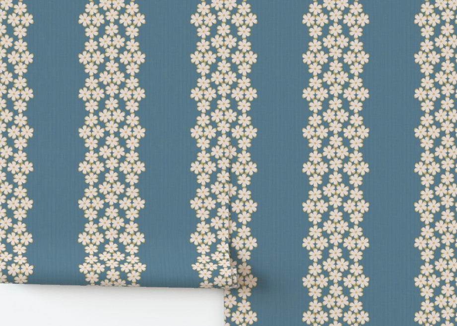 Roll of wallpaper with floral pattern on a blue background