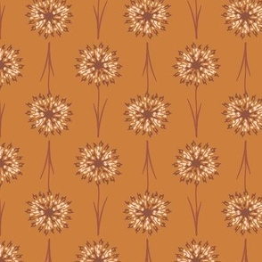 Pattern of stylized flowers on a brown background