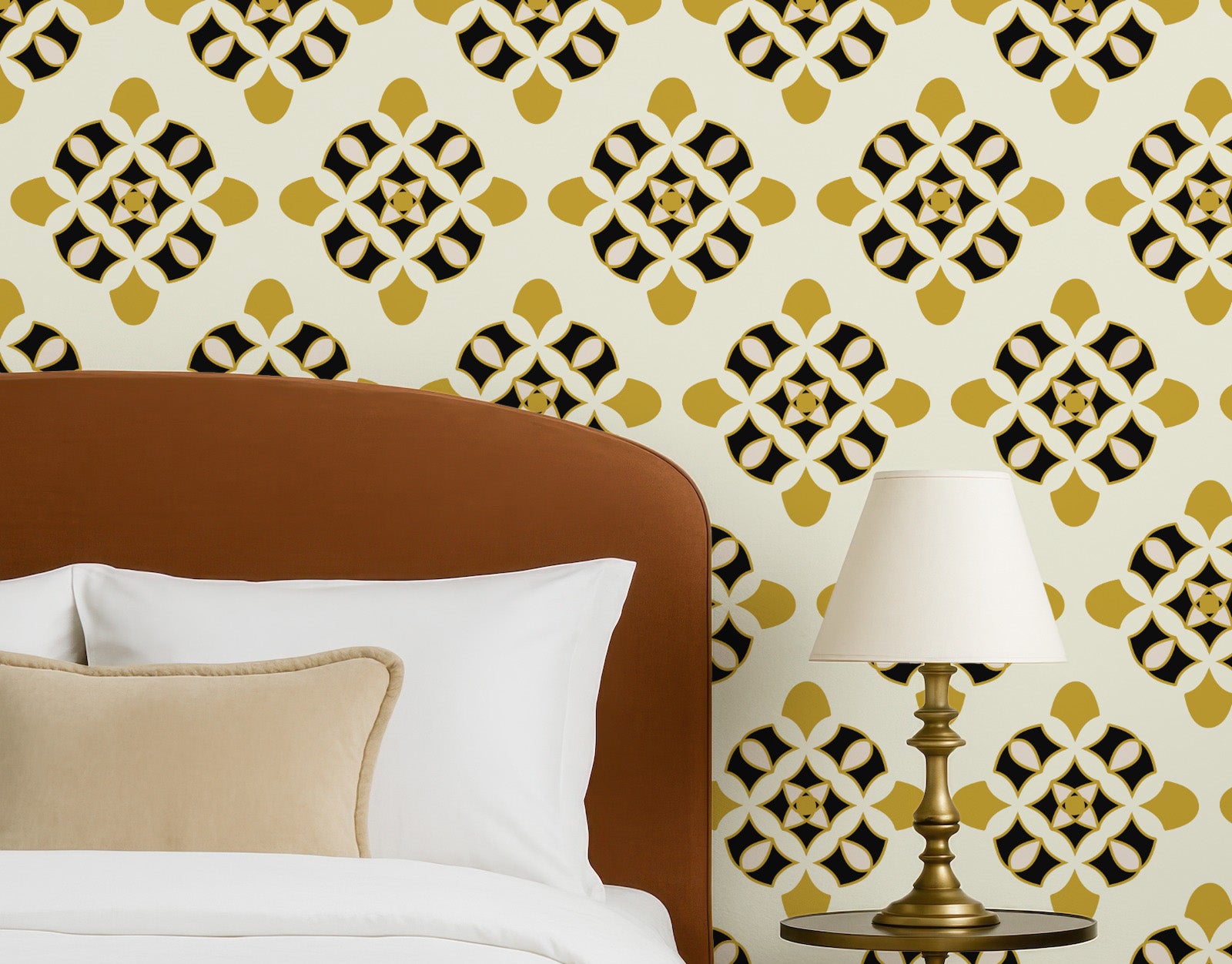 Bedroom with patterned wallpaper, brown headboard, white pillows, and gold lamp.