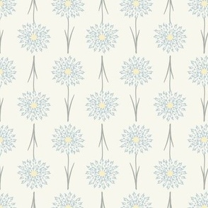 Pattern of stylized flowers with blue centers on a white background
