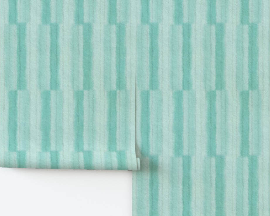 Teal vertical stripe patterned wallpaper on a white wall with a wooden baseboard.