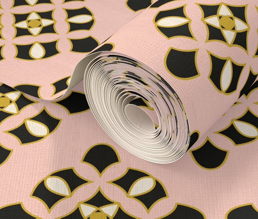 Roll of pink paper with black and gold geometric pattern