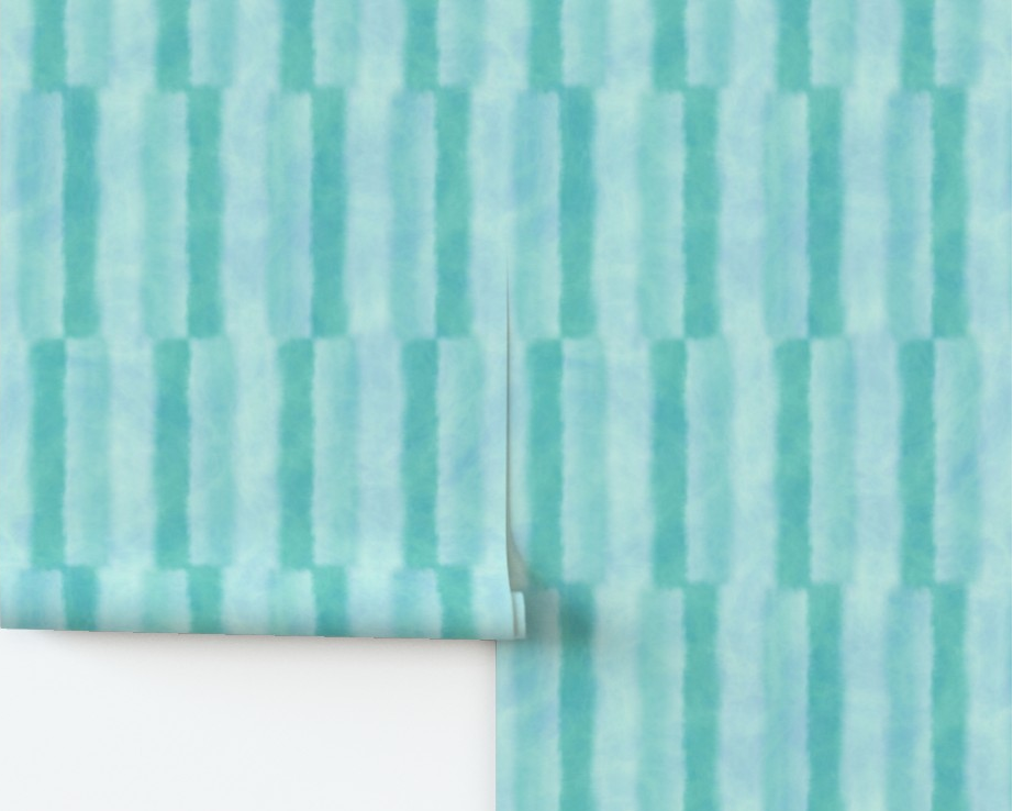 Teal striped patterned paper on a white surface with a wooden edge.