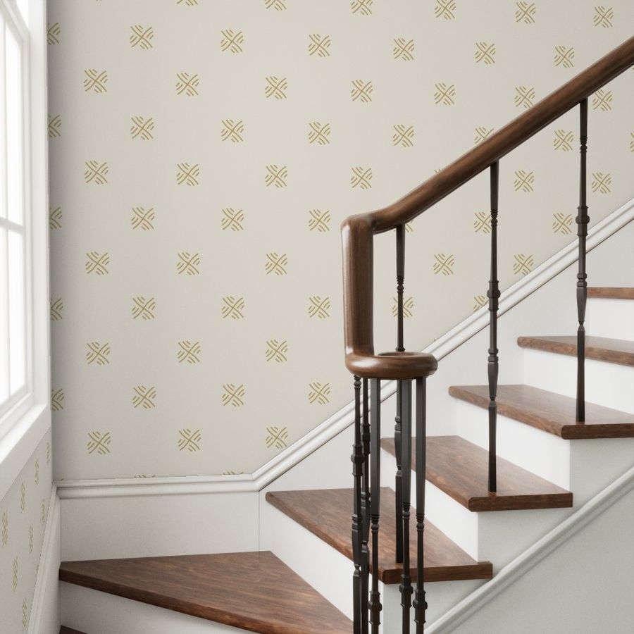 Wooden staircase with a decorative wallpaper simple stitches pattern in a home interior.