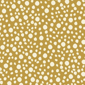 Pattern of white dots on a mustard yellow background