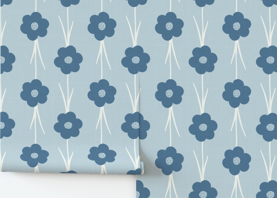 Floral patterned paper with blue flowers on a light blue background