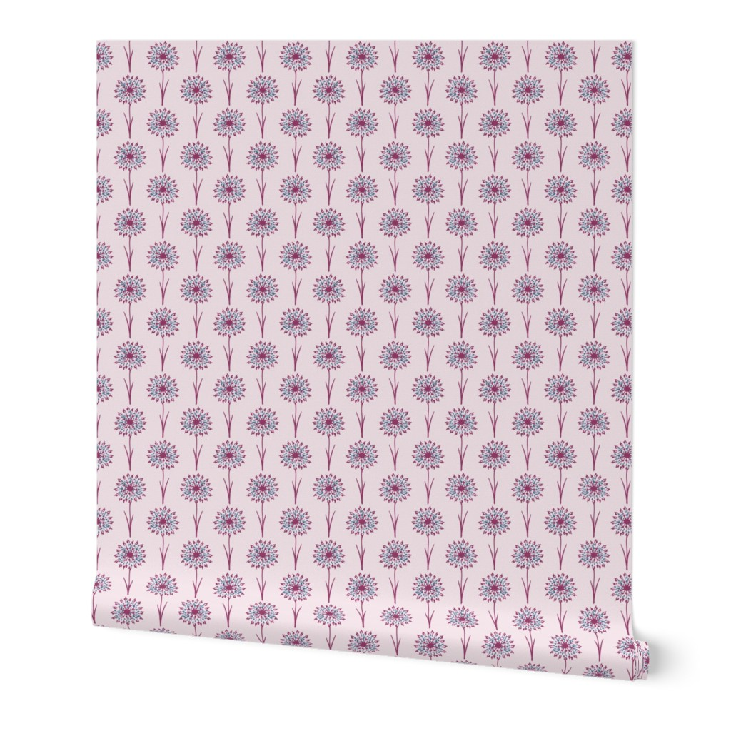 Roll of pink paper with purple floral pattern on a white background