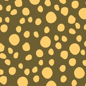 Pattern of yellow polka dots on a green background